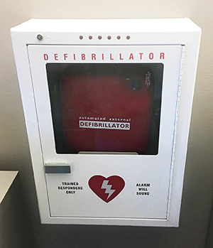 Automated external defibrillator machine on wall.